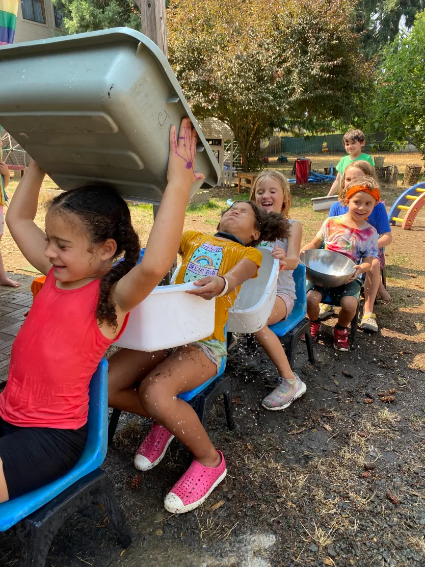 Campers laughing during outdoor water play